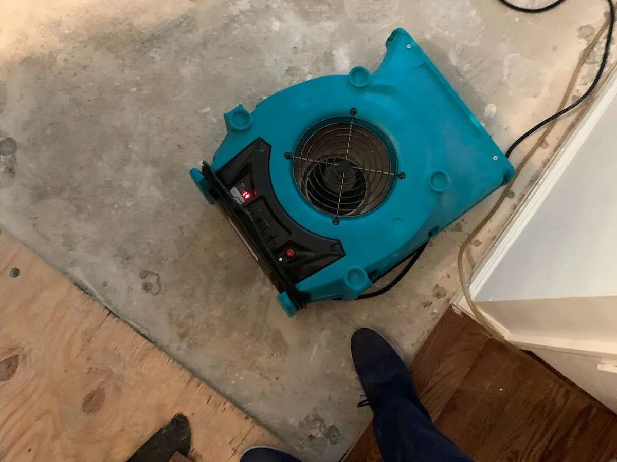 Air mover drying subfloor during Leak Detection & Repair in Duncan